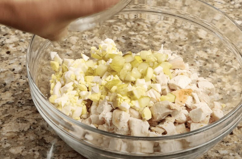 Combining the ingredients for the chicken salad
